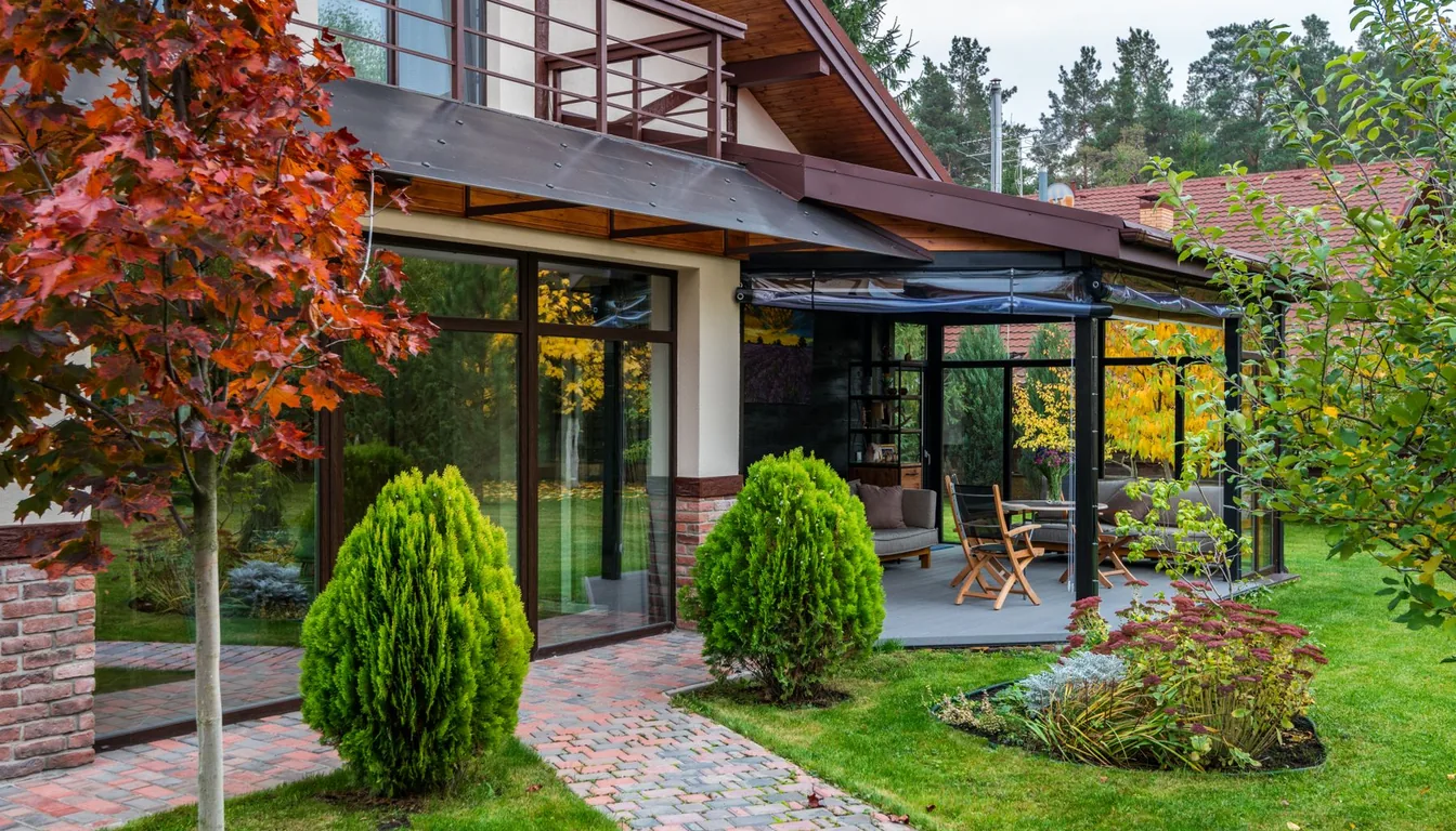 A house behind autumn foliage turning red